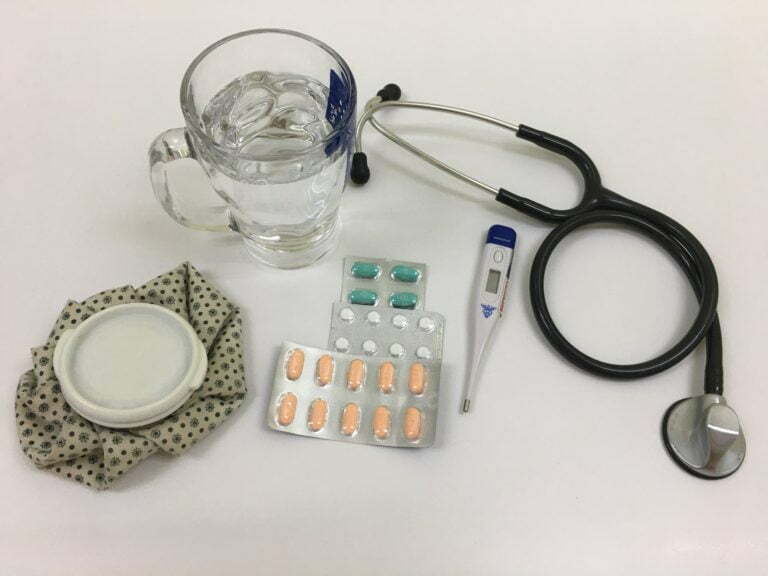 a medical device with a glass and pills