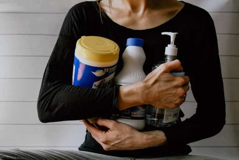 a person holding a bottle of alcohol