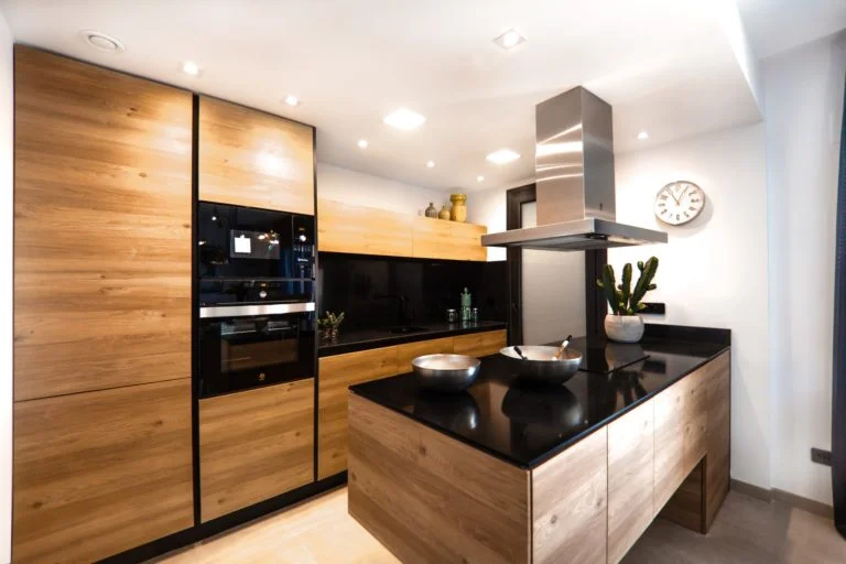 a kitchen with black appliances