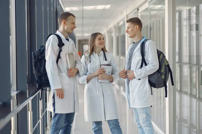 a group of people standing in a hallway