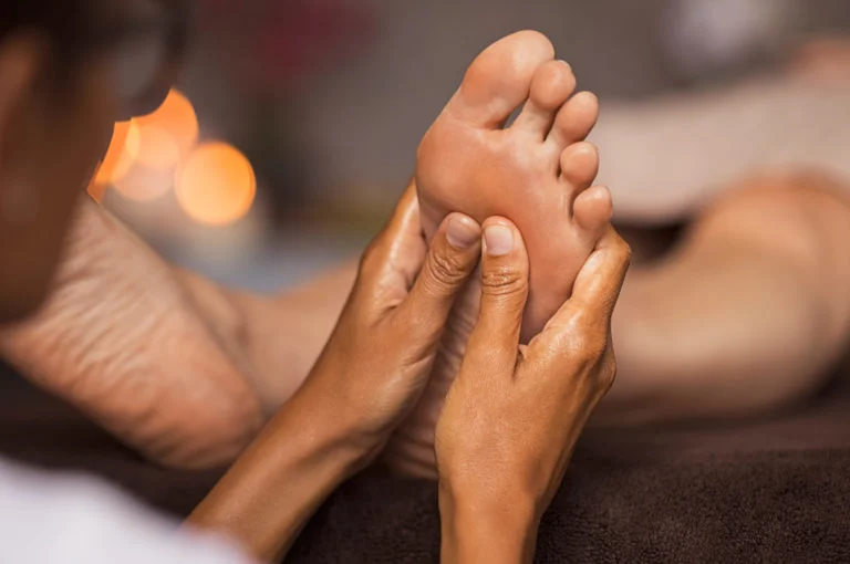 a close-up of hands clasped together